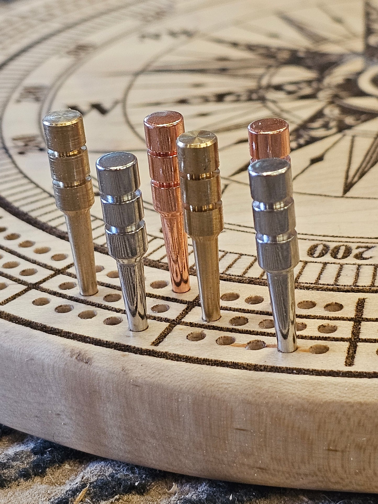 Personalized Round hardwood Cribbage Boards with in board peg storage. A practical gift for any occasion.