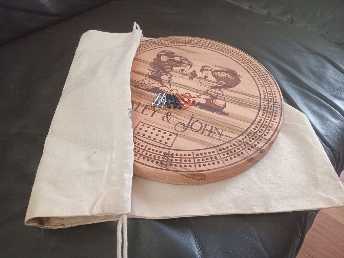 Personalized Round hardwood Cribbage Boards with in board peg storage. A practical gift for any occasion.