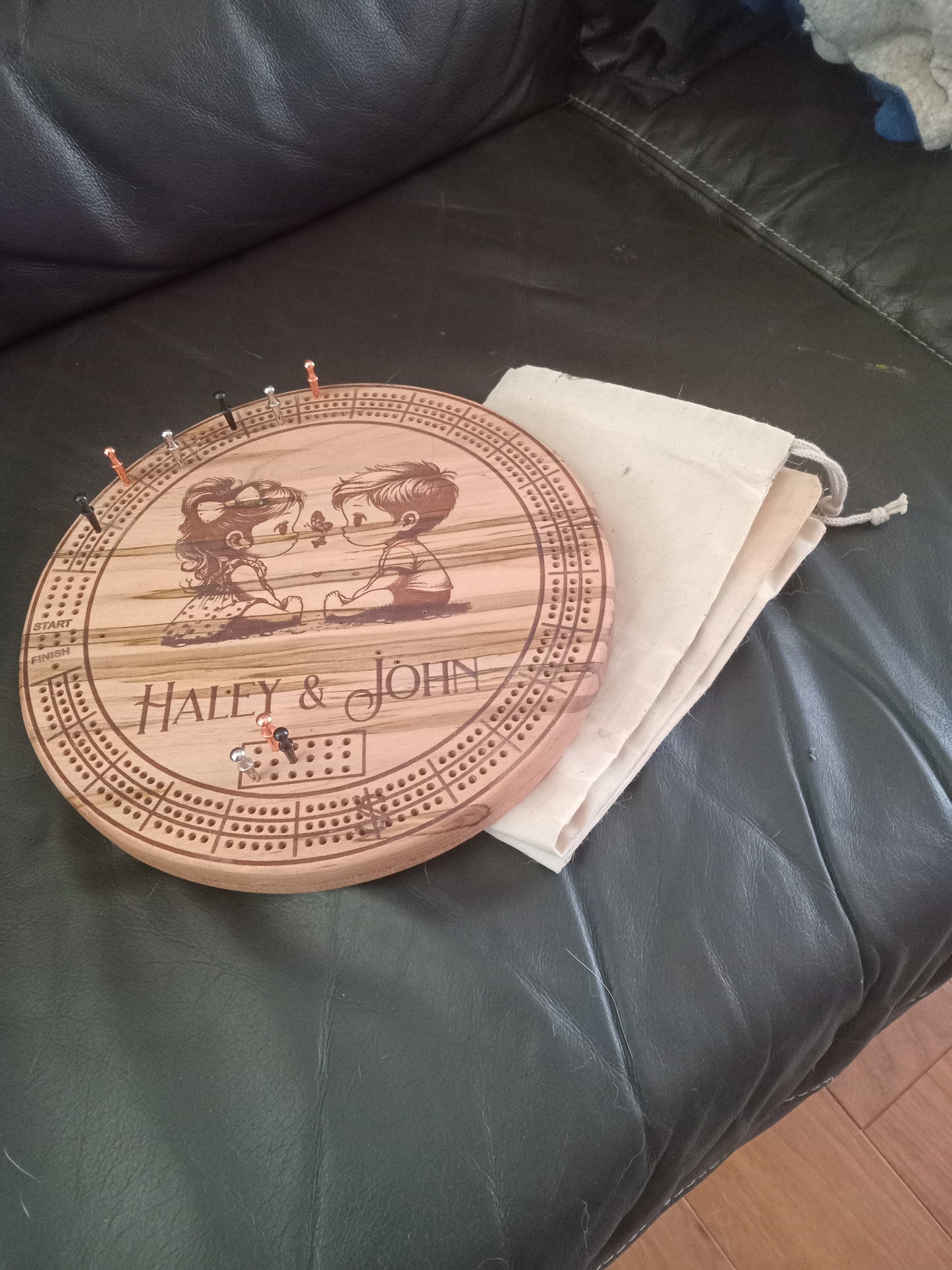 Personalized Round hardwood Cribbage Boards with in board peg storage. A practical gift for any occasion.