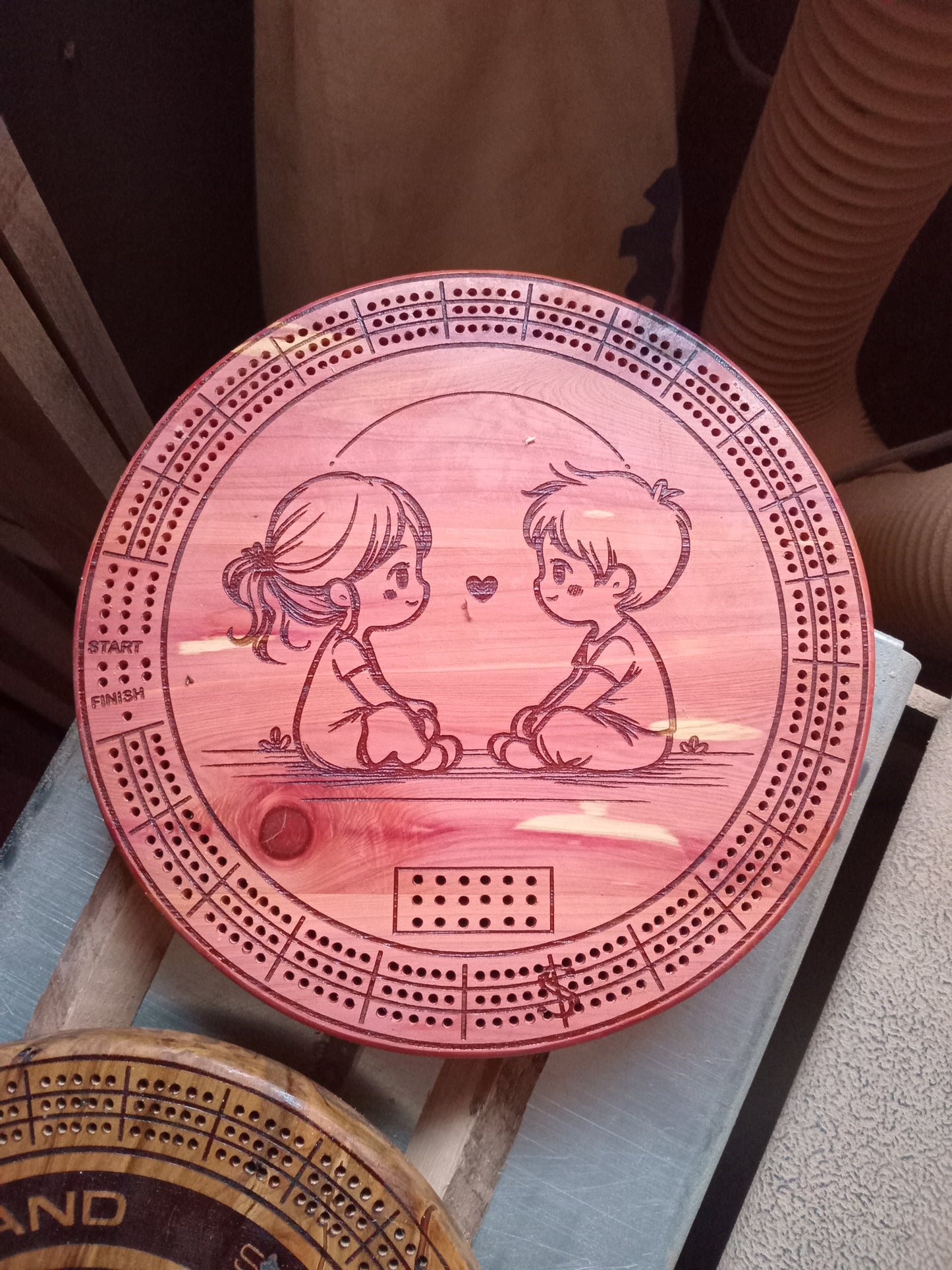 Personalized Round hardwood Cribbage Boards with in board peg storage. A practical gift for any occasion.