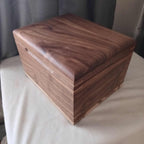 Custom wooden urn handcrafted in Canada shaped like a treasure chest