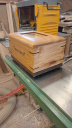 Custom personalized hardwood pet urn with paw prints and photo slot handcrafted in Canada