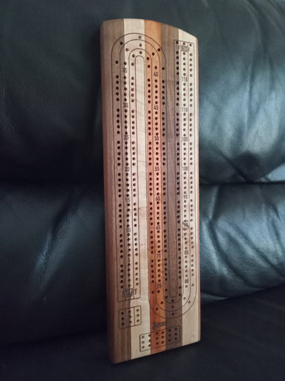 “Handcrafted Multi Wood Cribbage Boards with peg storage. A practical gift for all occasions.