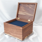Handcrafted custom wooden urn in the shape of a treasure chest made in Canada
