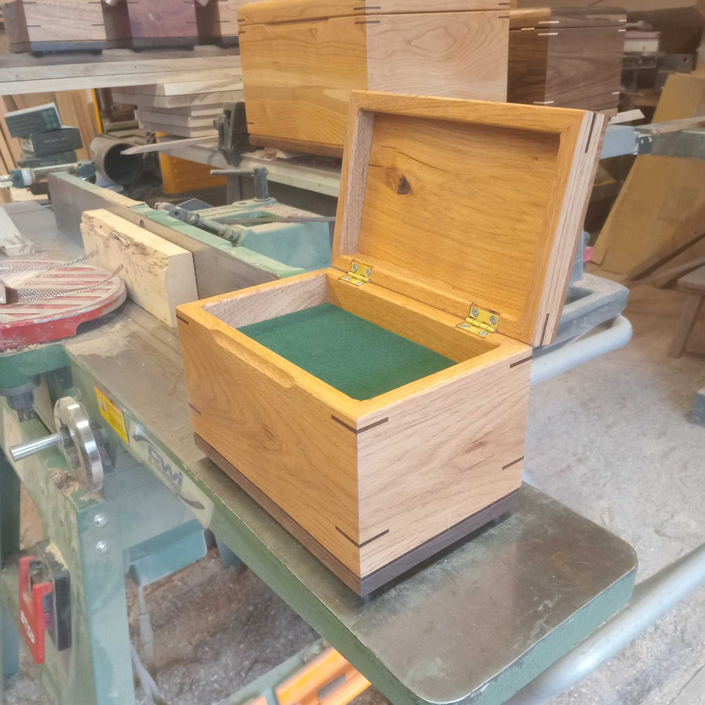 Custom handcrafted wood box urn with paw print engraving for pet ashes keepsake