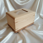 Custom personalized hardwood pet urn with paw prints and photo slot handcrafted in Canada
