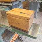 Custom handcrafted wood box urn with paw print design for pet ashes keepsake