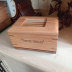 Custom personalized hardwood pet urn with paw prints and photo slot for ashes memorial