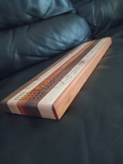 “Handcrafted Multi Wood Cribbage Boards with peg storage. A practical gift for all occasions.