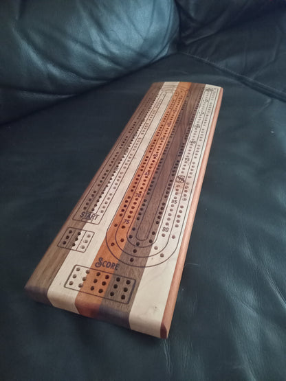 “Handcrafted Multi Wood Cribbage Boards with peg storage. A practical gift for all occasions.