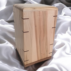 Personalized hardwood pet urn with pawprint engraving and modern design