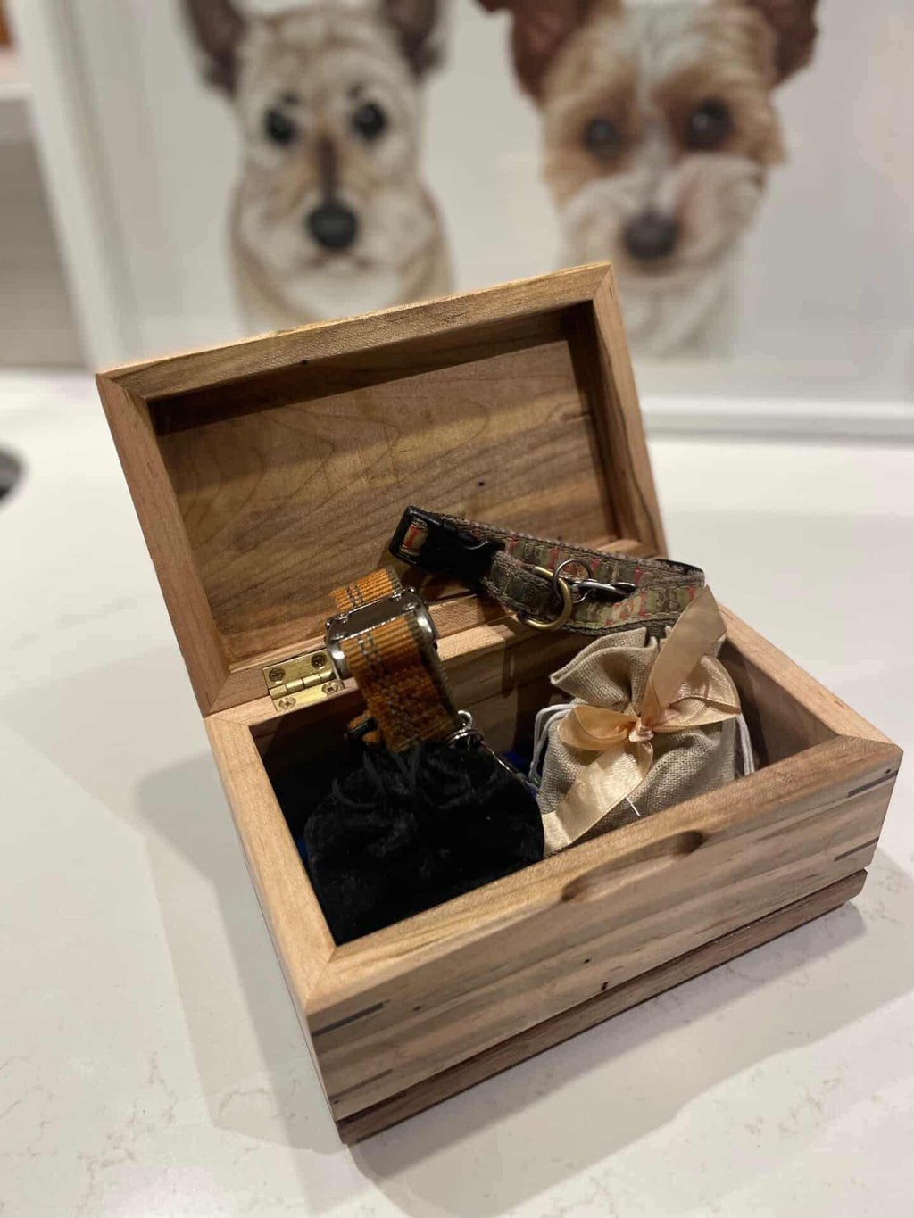Handcrafted cremation urn for pets with open paw design made from natural wood grain hardwood