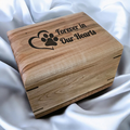 Handcrafted wooden urn for animal ashes with paw prints, made in Canada, customizable engraving options