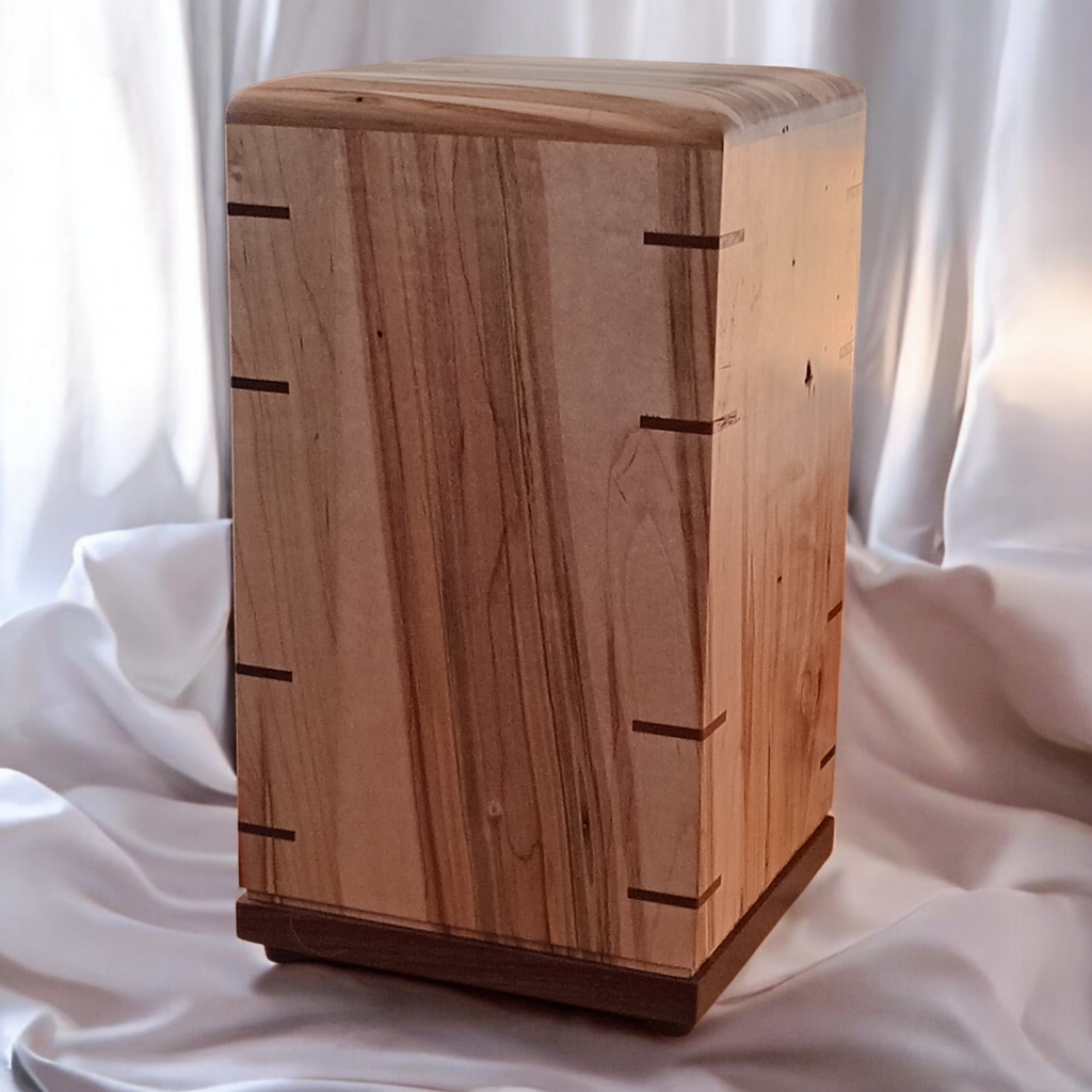 Handcrafted solid hardwood memorial urn for ashes with natural finish and secure closure