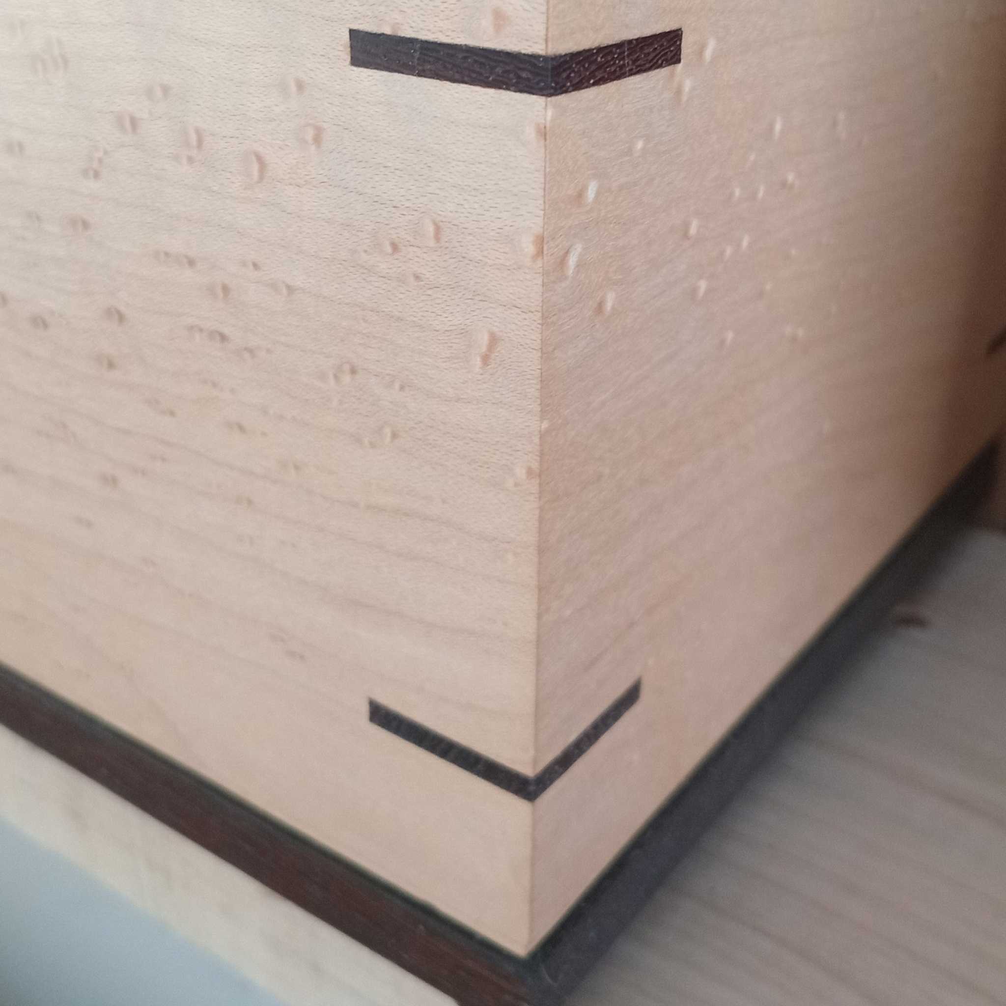 Handcrafted wooden urn for animal ashes with paw prints, made in Canada