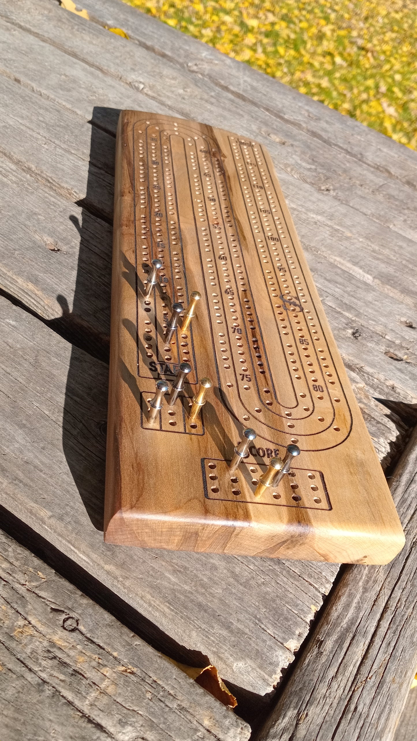 Handcrafted Wood Cribbage Boards with peg storage. A practical gift for all occasions.