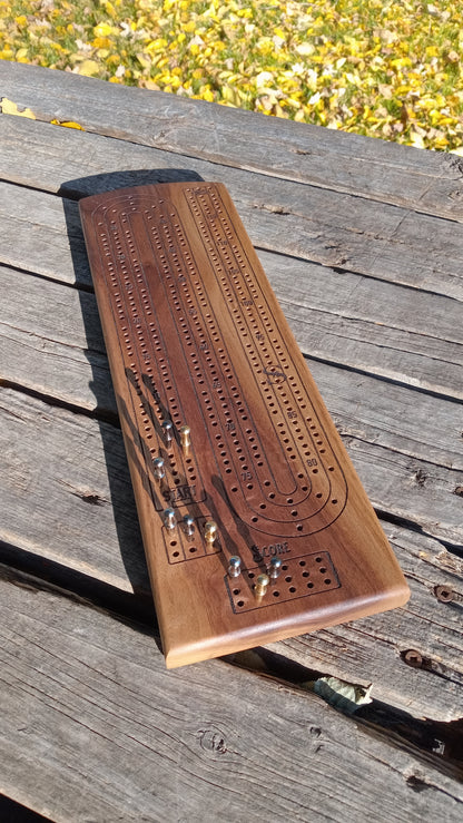 Handcrafted Wood Cribbage Boards with peg storage. A practical gift for all occasions.