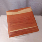Personalized hardwood pet urn with pawprint engraving and modern design