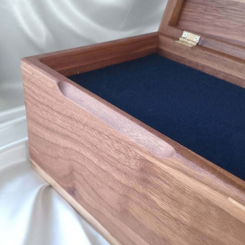 Handcrafted custom wooden urn shaped like a treasure chest, made in Canada
