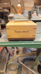 Custom personalized hardwood pet urn with paw prints and photo slot for ashes memorial