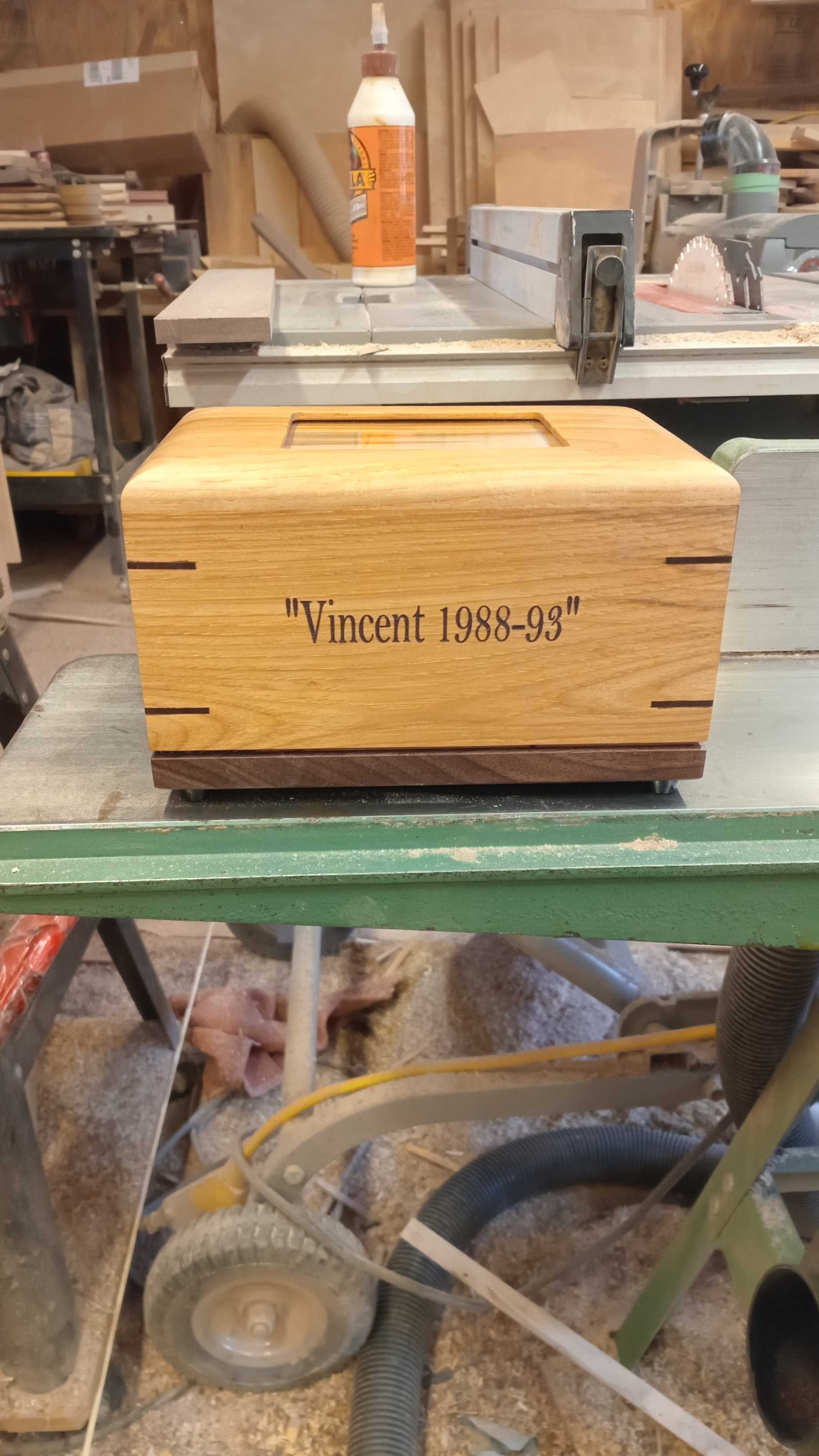 Custom personalized hardwood pet urn with paw prints and photo slot for ashes memorial