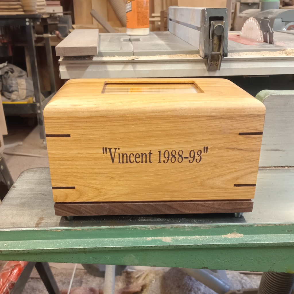 Custom personalized hardwood pet urn with paw prints and photo slot for ashes memorial
