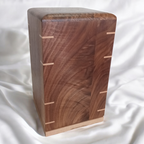 Personalized hardwood pet urn with pawprint engraving and clean modern design