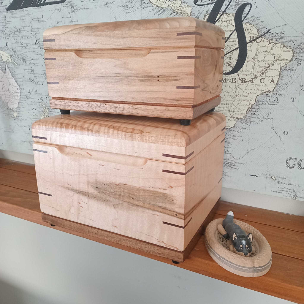 Handcrafted cremation urn for pets made of solid hardwood with custom engraving option