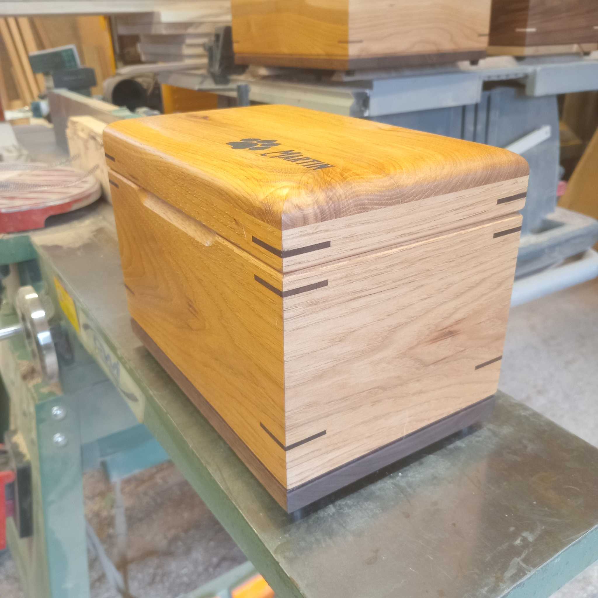 Custom wood box urn with paw print engraving for animal ashes keepsake