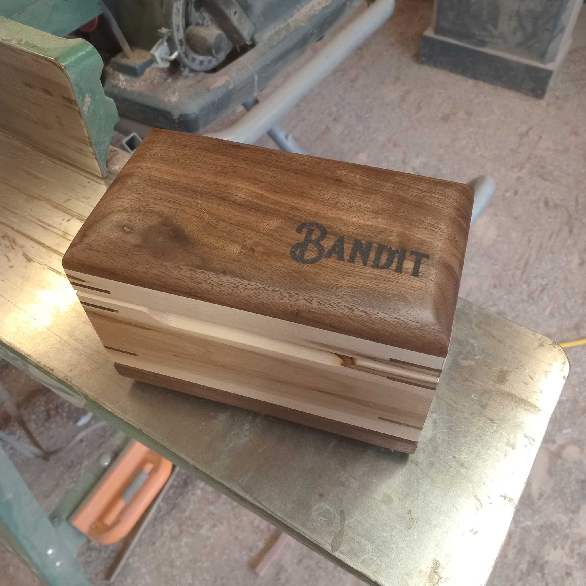 Custom handcrafted wooden pet urn with engraved paw prints keepsake box