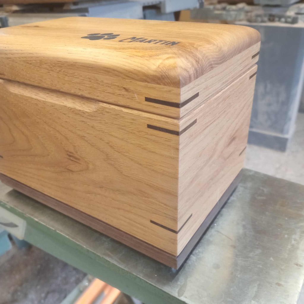 Handcrafted custom wood box urn for pet ashes with paw print design and keepsake top