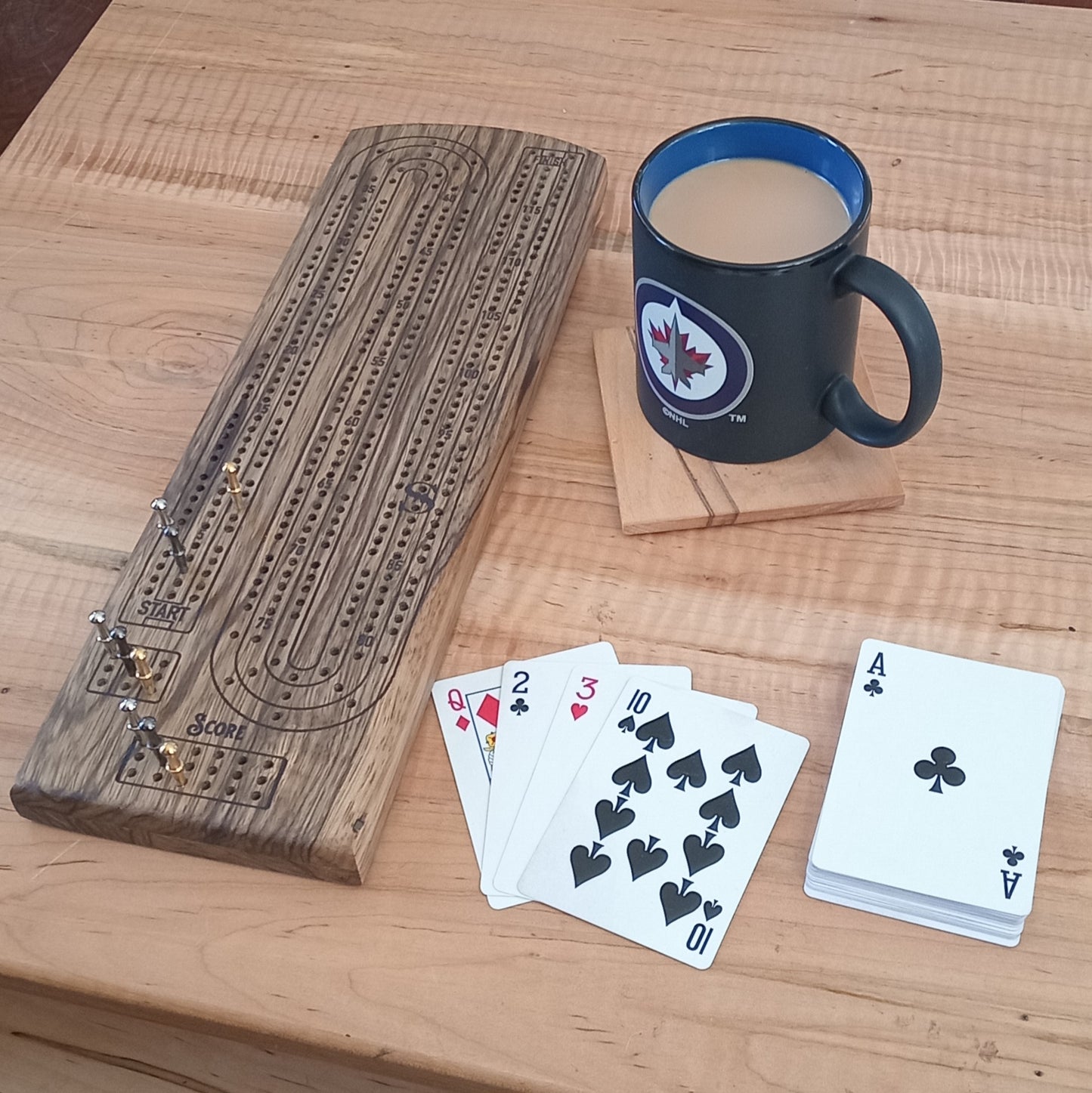 Handcrafted Wood Cribbage Boards with peg storage. A practical gift for all occasions.