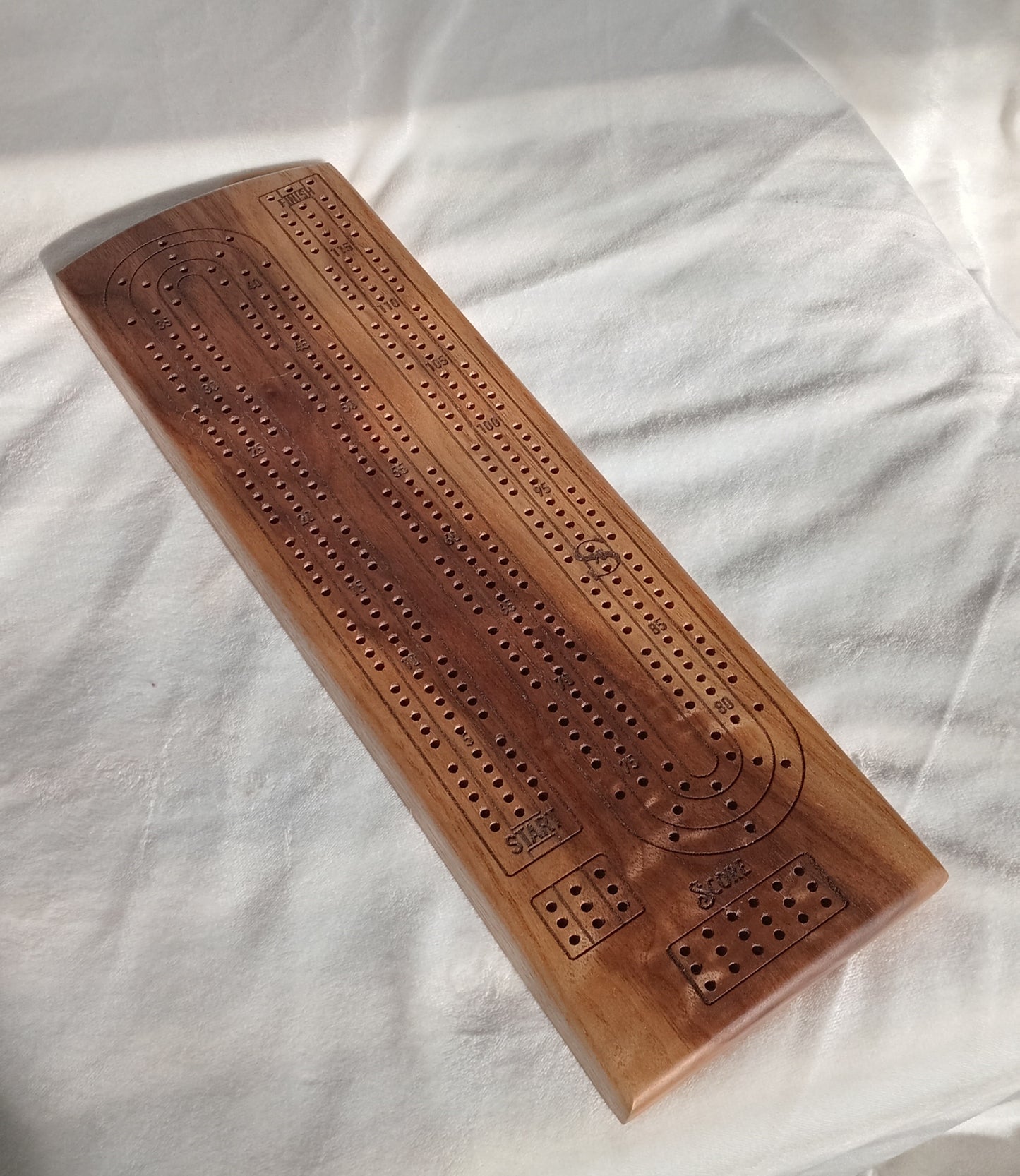 Handcrafted Wood Cribbage Boards with peg storage. A practical gift for all occasions.