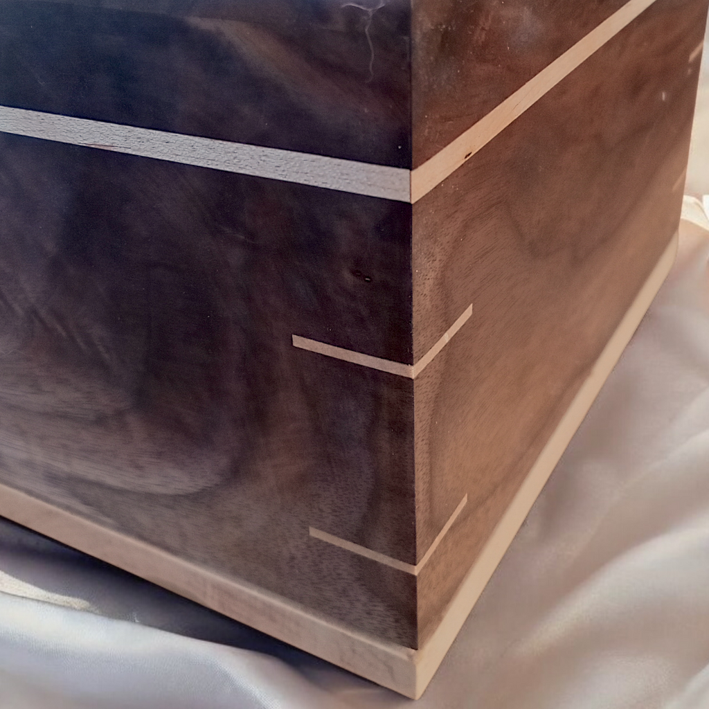 Handcrafted hardwood urn made in Canada with a smooth, timeless design and secure closure for ashes