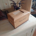 Custom personalized hardwood pet urn with paw prints and photo slot for ashes memorial