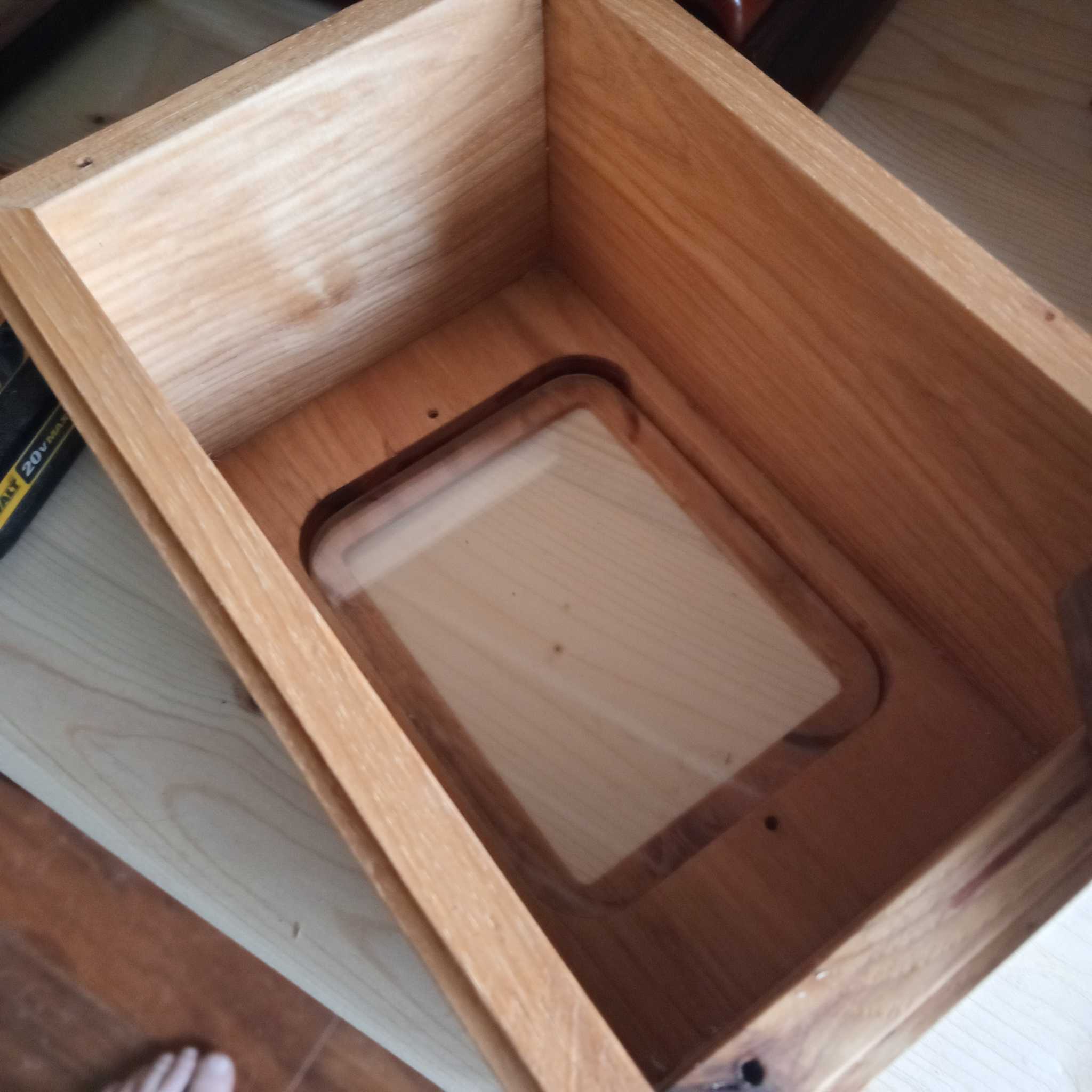 Custom personalized hardwood pet urn with paw prints and photo slot handcrafted in Canada