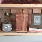 Handcrafted memorial urn made from solid hardwood with simple, natural design for ashes storage