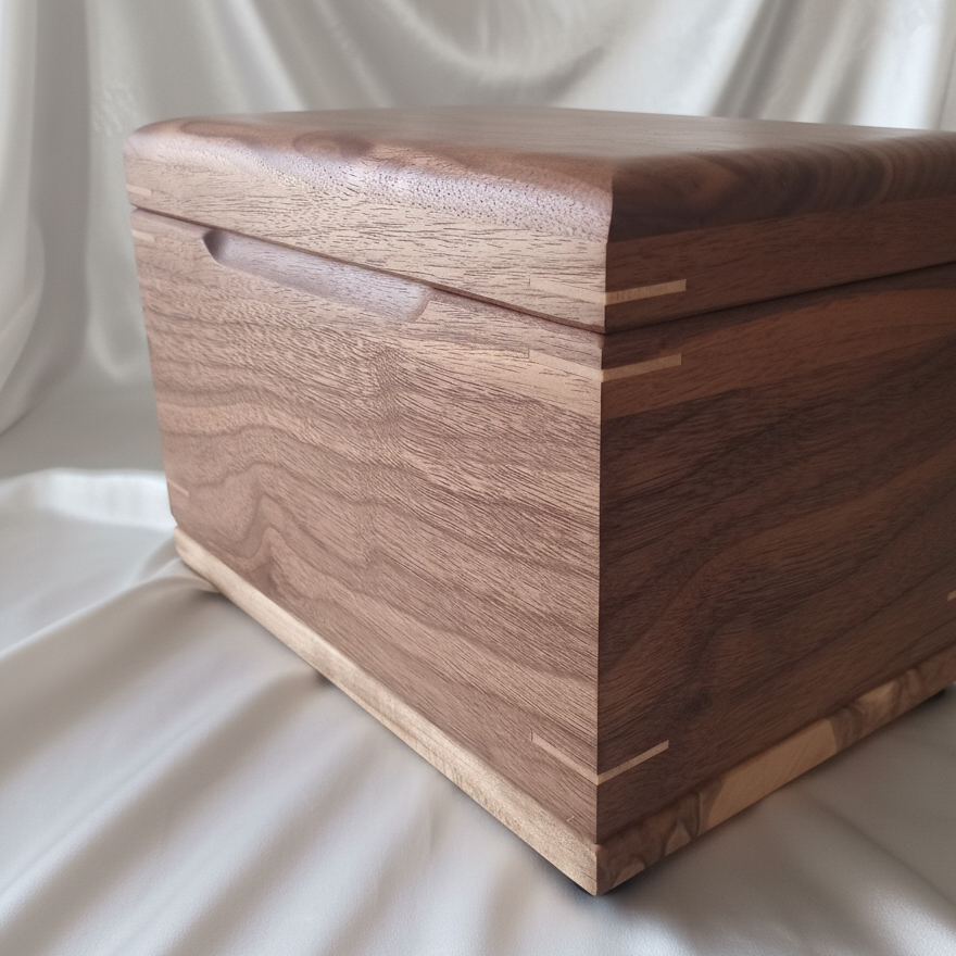 Handcrafted custom wooden urn shaped like a treasure chest, made in Canada