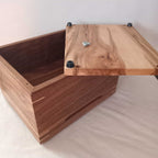 Handcrafted custom wooden urn in the shape of a treasure chest made in Canada