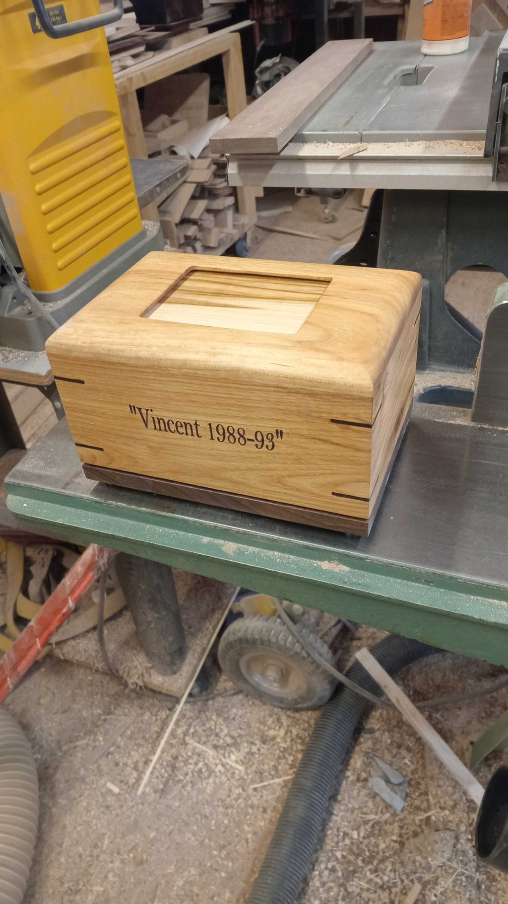 Handcrafted custom personalized hardwood pet urn with paw prints and photo slot for ashes memorial