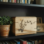 Wooden cremation urn with personalized butterfly engraving on the front
