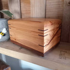 Handcrafted hardwood memory keepsake box with brass hinges and felt-lined interior for storing precious memories
