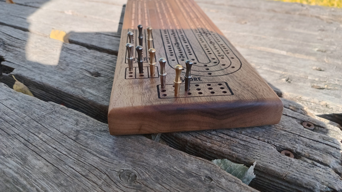 Handcrafted Wood Cribbage Boards with peg storage. A practical gift for all occasions.