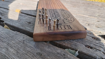 Handcrafted Wood Cribbage Boards with peg storage. A practical gift for all occasions.