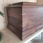 Traditional handmade memorial urn crafted from solid hardwood with a clean, timeless design for cremation ashes