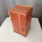 Personalized hardwood pet urn with pawprint engraving and modern design