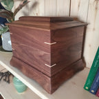 Traditional handmade memorial urn made of solid hardwood with a clean, timeless design for cremation ashes
