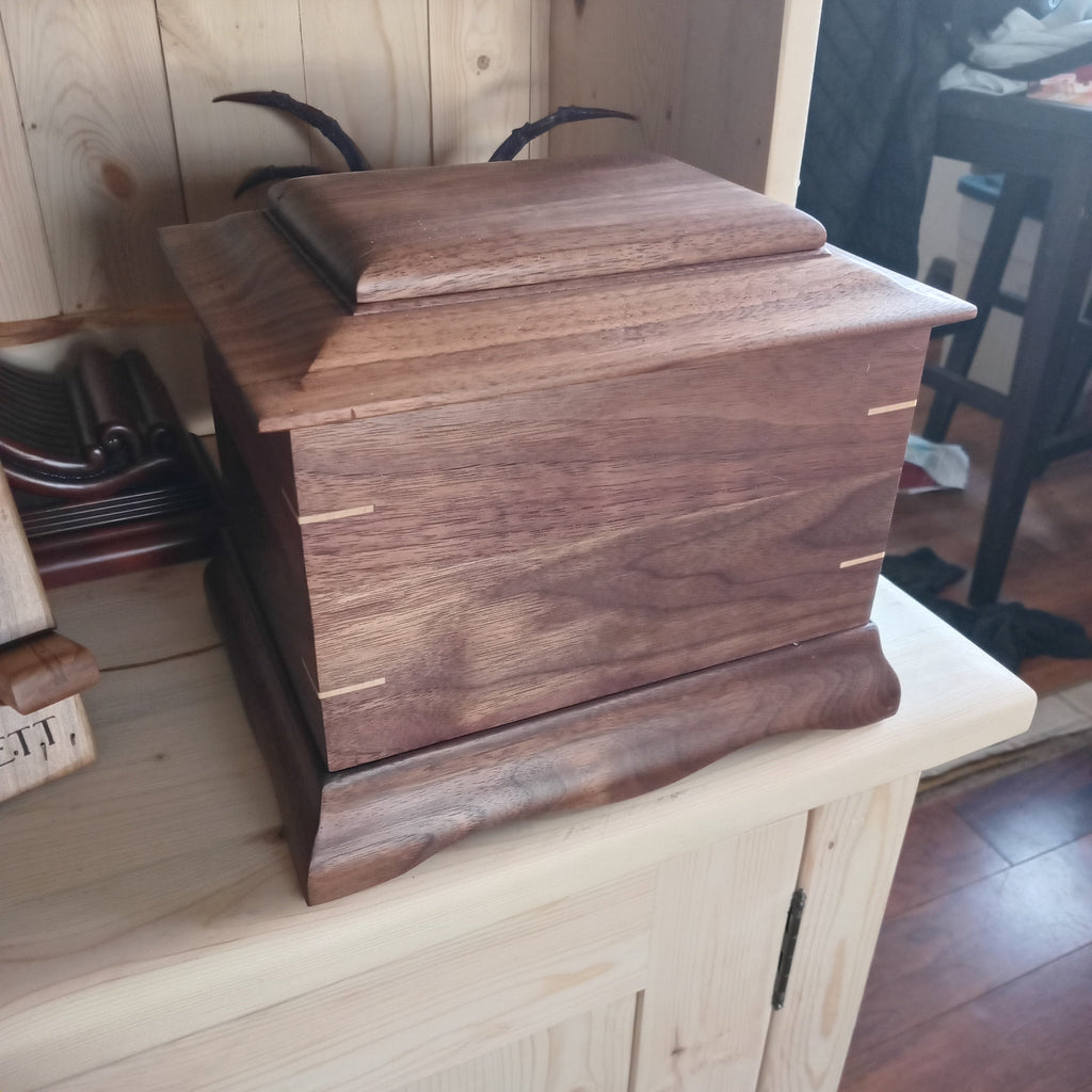 Traditional handmade memorial urn crafted from solid hardwood with a smooth finish