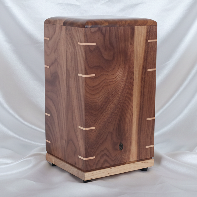 Handcrafted memorial urn made from solid hardwood with natural finish and secure closure