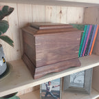 Traditional handmade memorial urn crafted from solid hardwood for cremation ashes